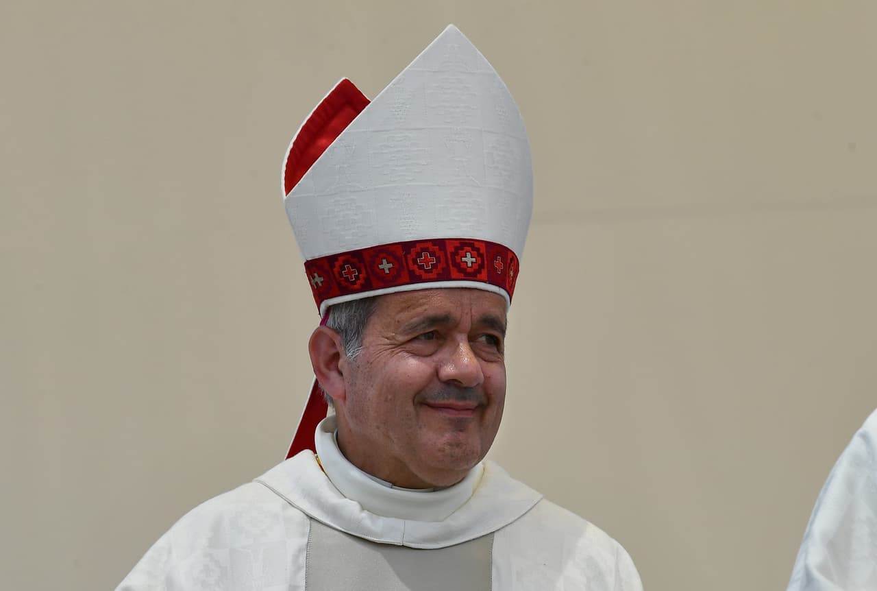 The bishop of Osorno, Juan Barros, takes part in an open-air mass celebrated by Pope Francis at Lobitos Beach, near the Chilean northern city of Iquique, on January 18, 2018. Pope Francis on Thursday strongly defended Barros who accused of covering up a priest's sexual abuse of minors. "The day they bring me proof against Bishop Barros, then I will speak," the pope said in response to a journalist's question about the 61-year-old bishop, appointed by Francis in 2015 despite being accused of covering up another priest's abuse of boys. Pope Francis will close his visit to Chile on January 18 with the open-air mass near Iquique, before leaving for Peru on the last leg of his South American trip. / AFP PHOTO / Vincenzo PINTO (Photo credit should read VINCENZO PINTO/AFP/Getty Images)