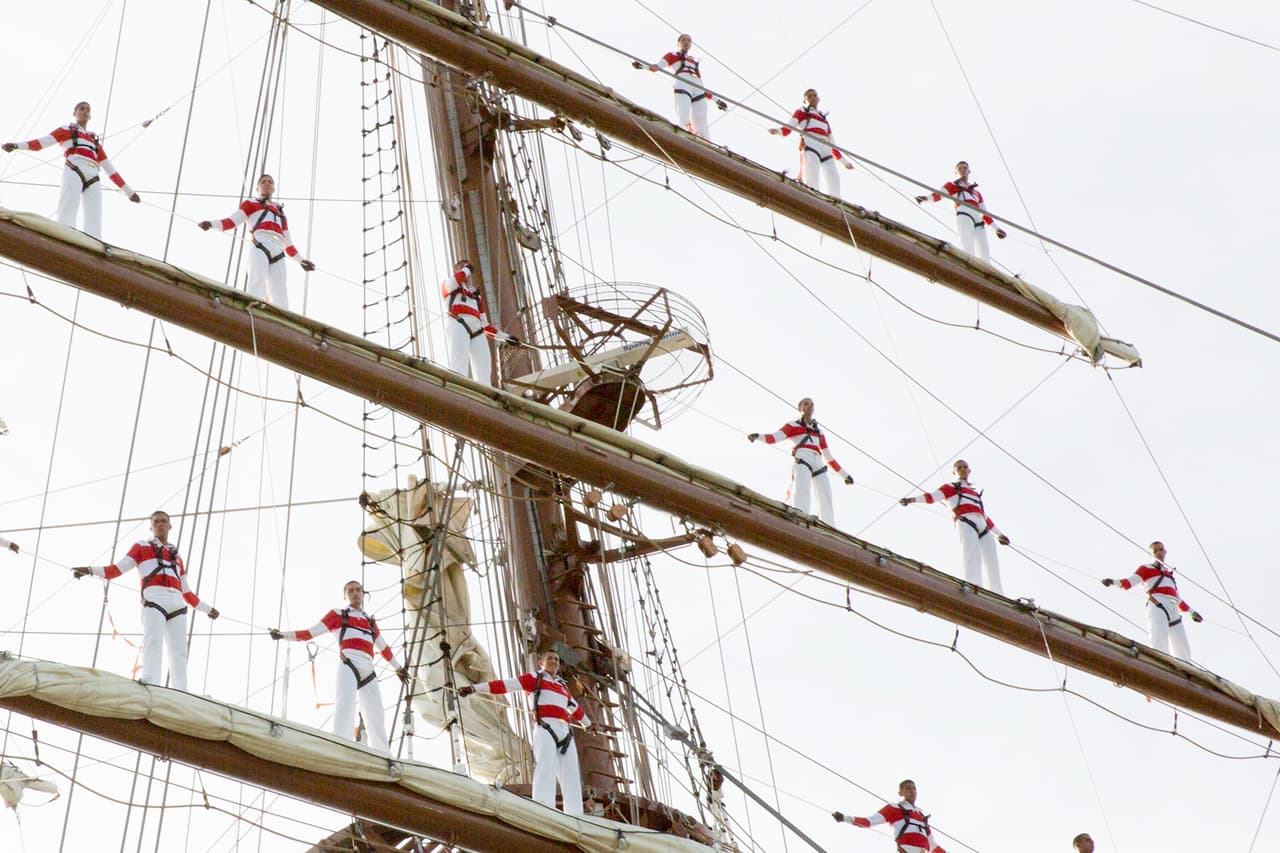 Aboard the B.A.P. Unión, the largest sailing training vessel in Latin America, 89 third-year cadets are perched on the horizontal spars of the three masts, a Peruvian Navy tradition.