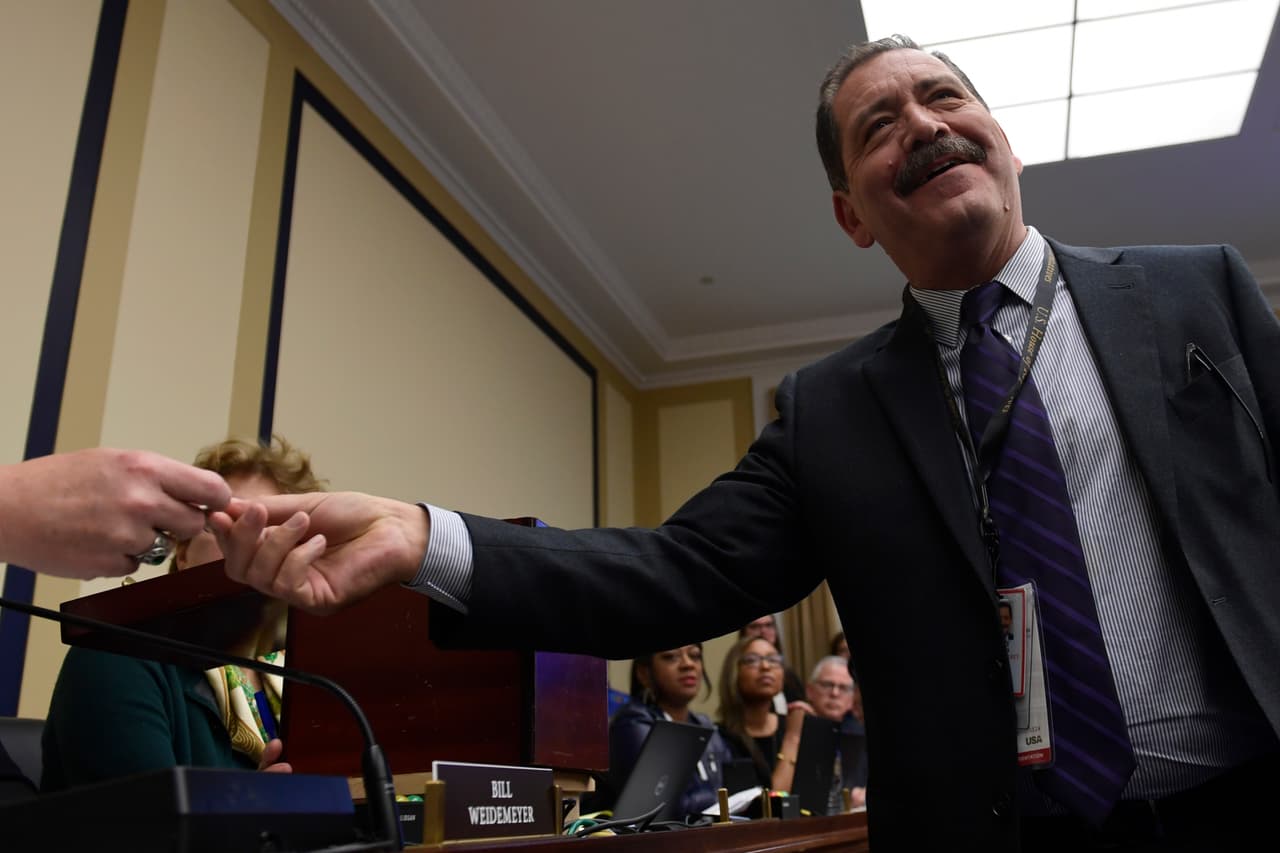 Rep.-Elect Jesus "Chuy" Garcia, D-Ill., draws his number during the Member-elect room lottery draw on Capitol Hill in Washington, Friday, Nov. 30, 2018. Garcia drew 57 out of 85, which determines the order in which he gets to select his new Capitol Hill office. (AP Photo/Susan Walsh)