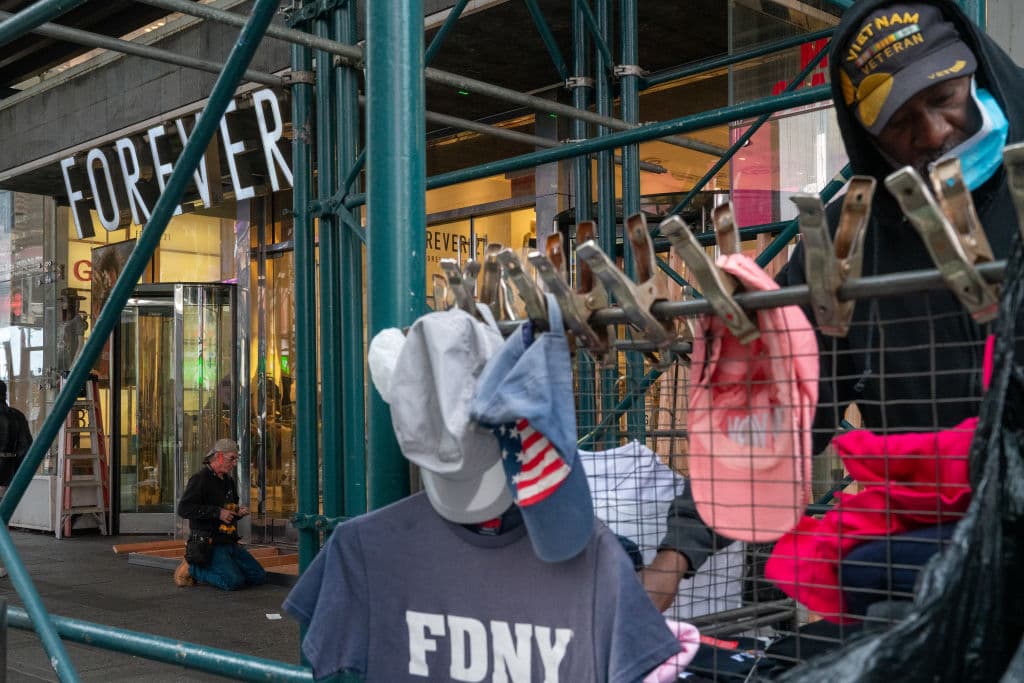 NEW YORK, NY - NOVEMBER 1: Carpenters board up a Forever 21 store in Times Square on November 1, 2020 in New York City. Businesses have taken to boarding up store fronts in anticipation of unrest related to the presidential election. (Photo by David Dee Delgado/Getty Images)
