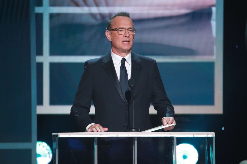 LOS ANGELES, CALIFORNIA - JANUARY 19: Tom Hanks presents Renée Zellweger with Outstanding Performance by a Female Actor in a Leading Role for 'Judy' onstage during the 26th Annual Screen Actors Guild Awards at The Shrine Auditorium on January 19, 2020 in Los Angeles, California. (Photo by Rich Fury/Getty Images)