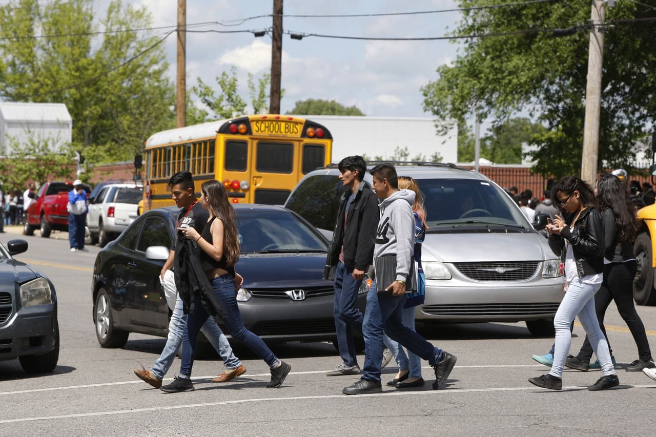 In this April 21, 2016, photo, students are shown in a Hispanic neighborhood in Memphis, Tenn. America's schools remain one of the few government institutions where migrant youth are guaranteed services, but the federal government has extended little money or oversight to monitor their impact and well-being, in part because schools are locally governed.