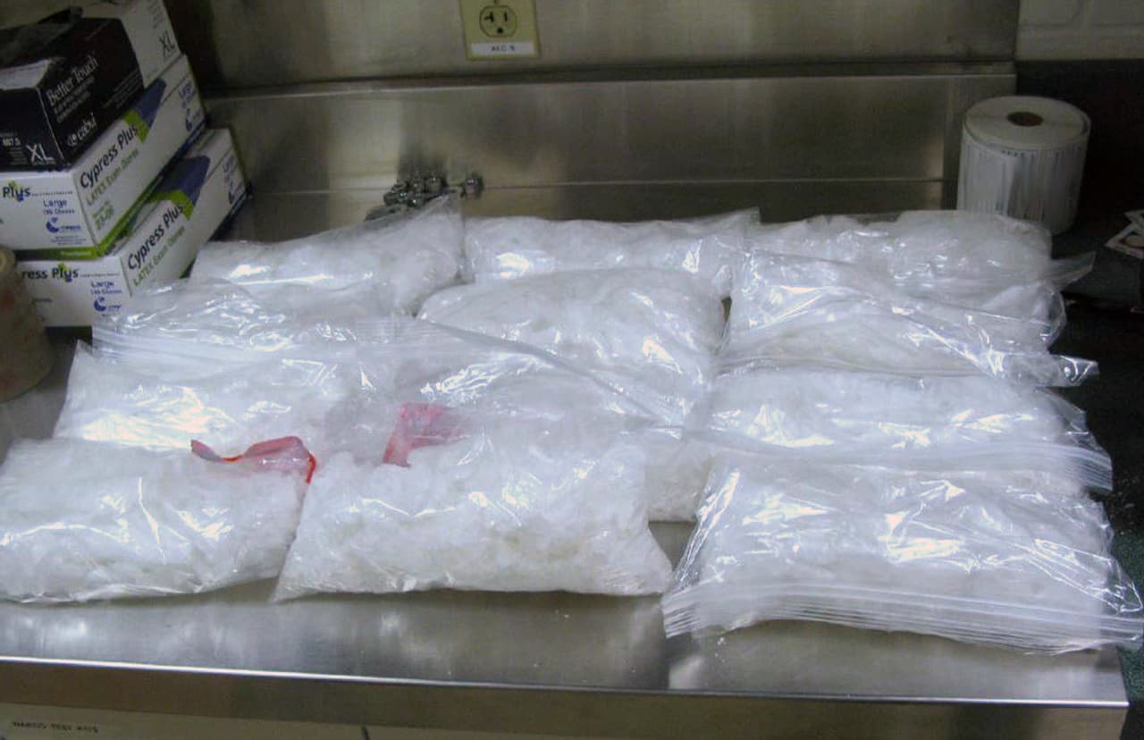 This undated photo provided by the U.S. Border Patrol shows 12 packages of methamphetamine that were confiscated from a U.S. citizen after a border patrol agent spotted a remote-controlled drone swooping over the border fence Tuesday, Aug. 8, 2017 at a border crossing near San Diego, Calif. Authorities have arrested a man they say used the drone to fly drugs across the Mexican border into California. (U.S. Border Patrol via AP)