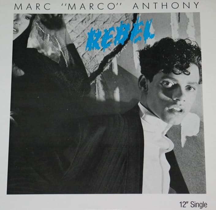 En 1988 lanzó su primer álbum 'Rebel'. En ese entonces su nombre apareció como Marc “Marco” Anthony.