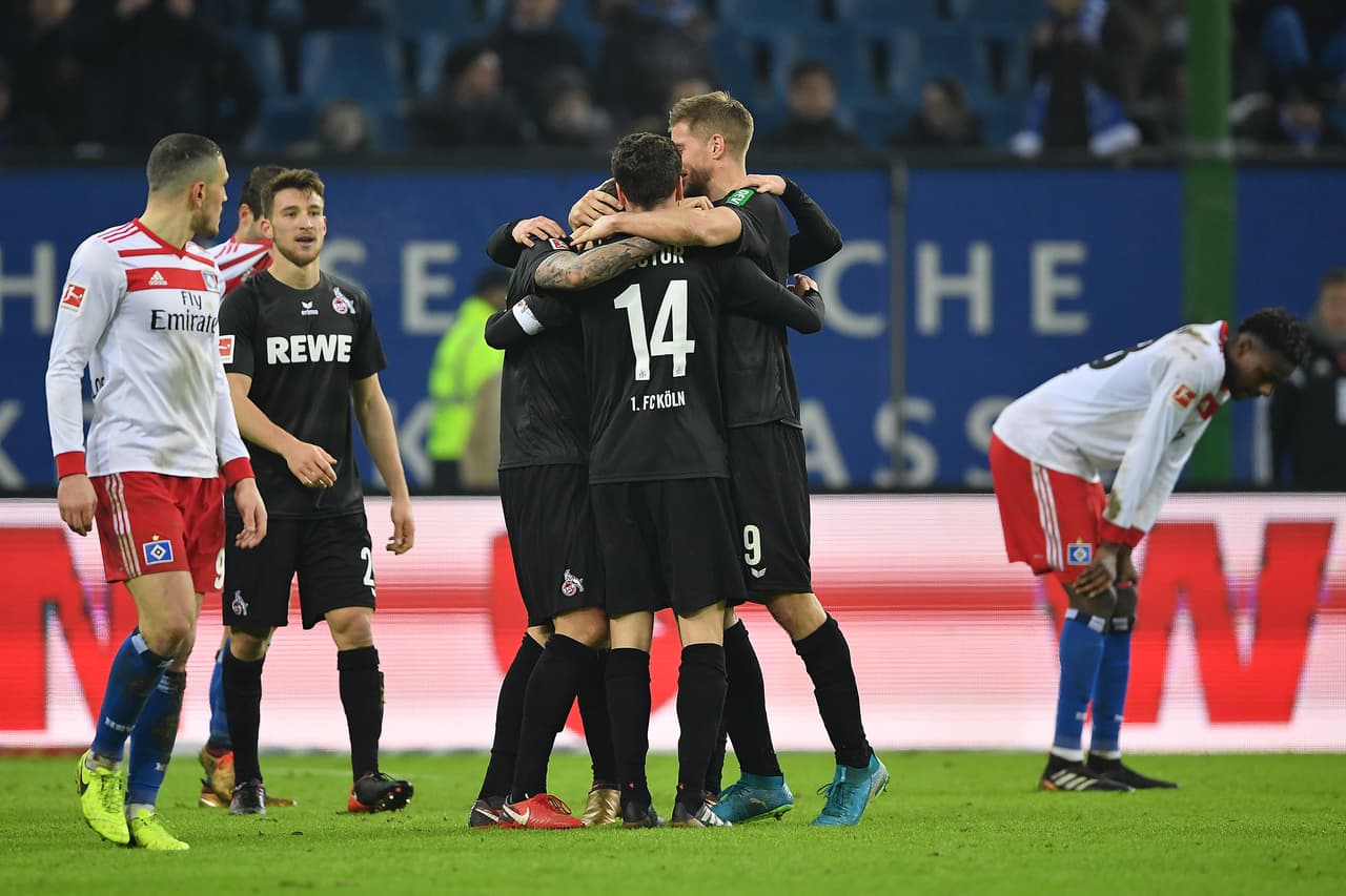 HAMBURG, GERMANY - JANUARY 20: Simon Terodde of Koeln (9) and layers of Koeln celebrate after the Bundesliga match between Hamburger SV and 1. FC Koeln at Volksparkstadion on January 20, 2018 in Hamburg, Germany. (Photo by Stuart Franklin/Bongarts/Getty Images)