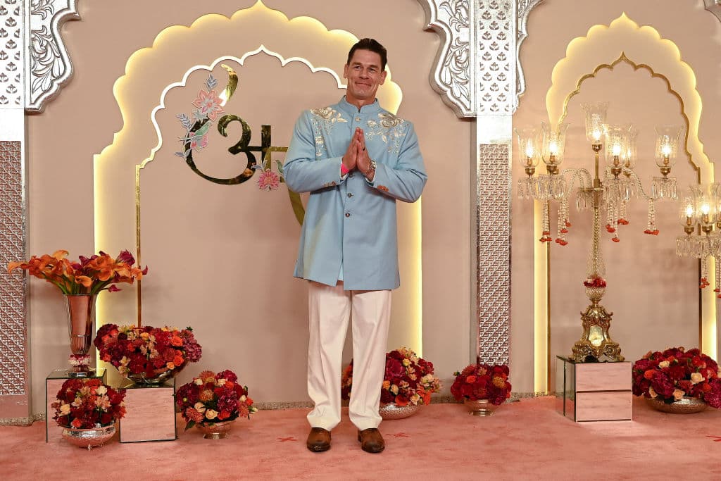 Hollywood actor John Cena gestures as he arrives to attend the wedding ceremony of billionaire tycoon and Chairman of Reliance Industries Mukesh Ambani's son Anant Ambani and Radhika Merchant in Mumbai on July 12, 2024. Socialite sisters Kim and Khloe Kardashian were among the global celebrities spotted in India on July 12 to attend a lavish three-day wedding ceremony staged by Asia's richest man Mukesh Ambani. (Photo by SUJIT JAISWAL / AFP) (Photo by SUJIT JAISWAL/AFP via Getty Images)
