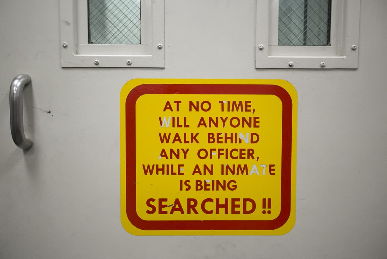 A signs on a door instructs searching procedure at the 4th Avenue Jail in Phoenix, Ariz. on Feb. 22nd, 2017.