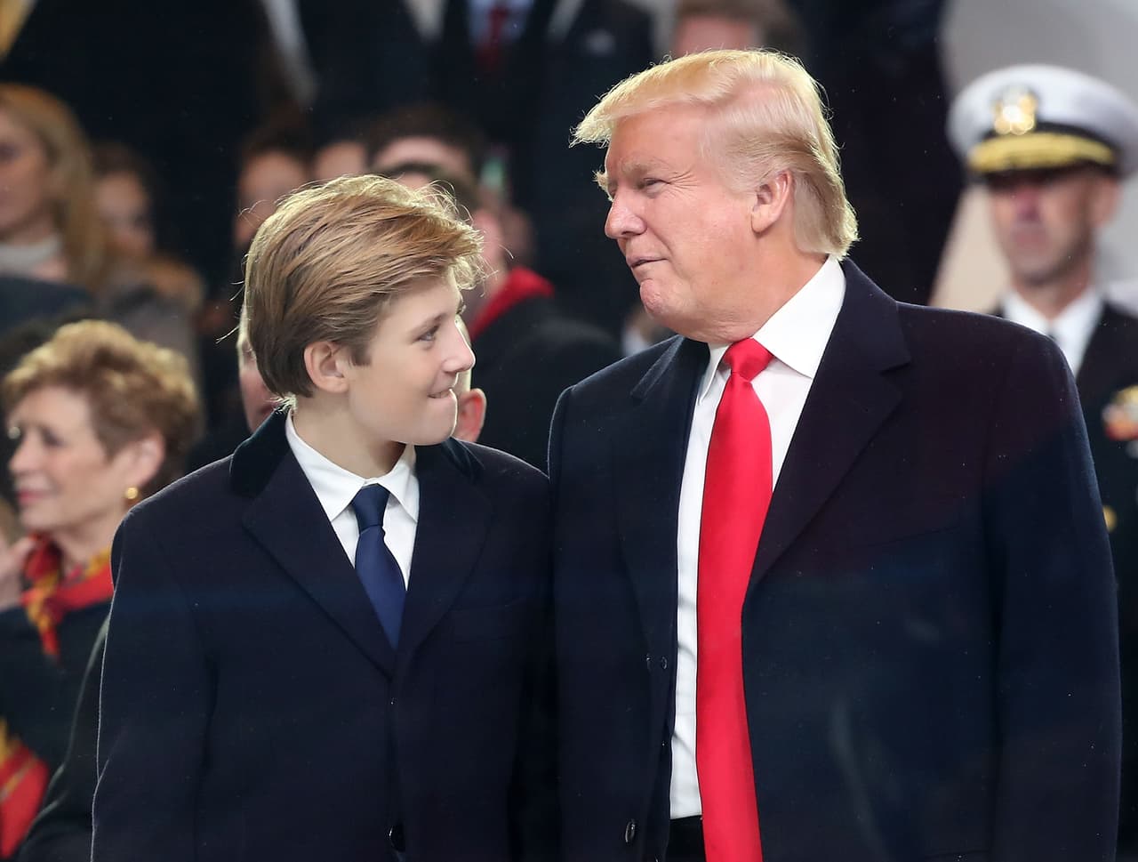 WASHINGTON, DC - JANUARY 20: U.S. President Donald Trump stands with his son Barron Trump inside of the inaugural parade reviewing stand in front of the White House on January 20, 2017 in Washington, DC. Donald Trump was sworn in as the nation's 45th president today. (Photo by Mark Wilson/Getty Images)