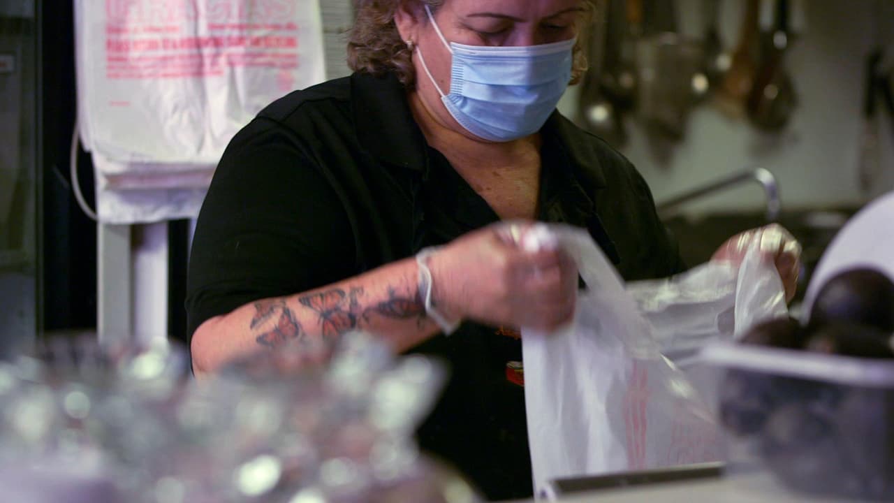 Carmen Castellanos preparing meals for delivery at Antojitos Carmen in Columbus Junction, Iowa.