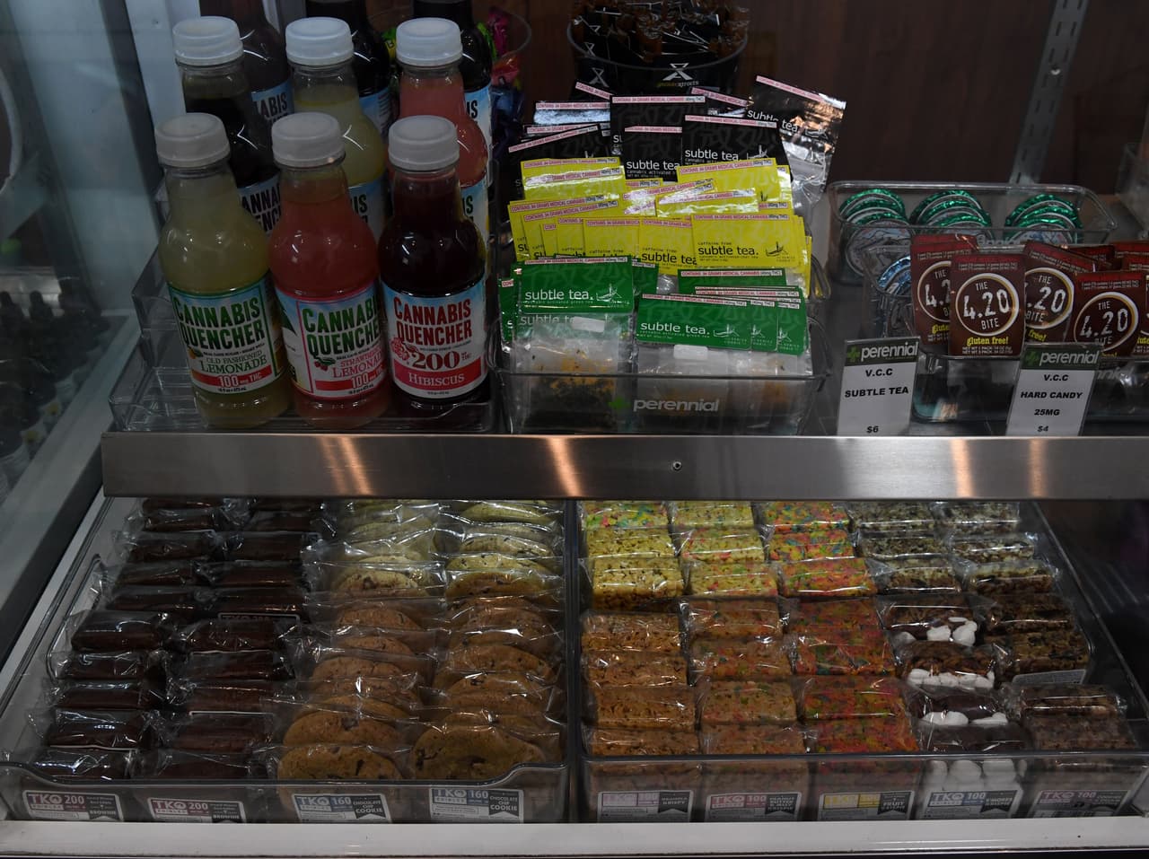 Marijuana products are seen for sale at the Perennial Holistic Wellness Center which is a medicinal marijuana dispensary in Los Angeles, California on March 24, 2017. Walk into Brett Vapnik's medicinal marijuana dispensary and the pungent aroma of pot is good and strong. All day long, hundreds of people file in and out, a sign of the strength of the pot industry, despite big question marks posed by the new administration of President Donald Trump. / AFP PHOTO / Mark RALSTON (Photo credit should read MARK RALSTON/AFP/Getty Images)