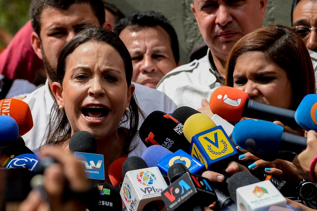 Venezuelan opposition ex-congresswoman Maria Corina Machado speaks to the press during a demonstration against the government of Venezuelan President Nicolas Maduro, in the streets of Caracas on December 20, 2016. A weekend of looting and clashes left at least three people dead in Venezuela, authorities said Monday, as anger roiled over a chaotic currency reform that left many without cash. / AFP / Federico PARRA (Photo credit should read FEDERICO PARRA/AFP/Getty Images)