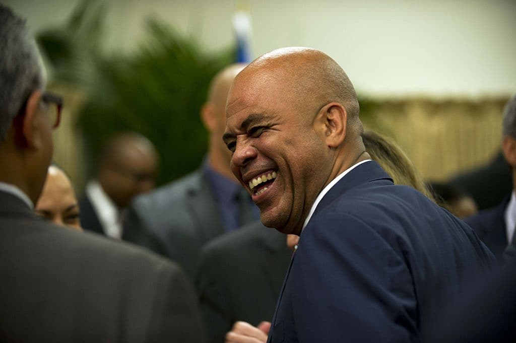 President Michel Martelly attends a meeting of an advisory commission December 9, 2014 in Port-au-Prince.