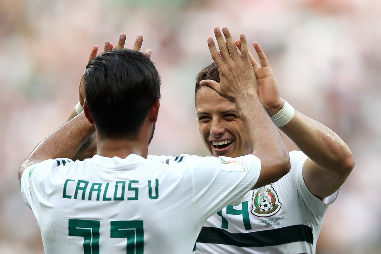 ROSTOV-ON-DON, RUSSIA - JUNE 23: Carlos Vela of Mexico celebrates with teammate Javier Hernandez after scoring a penalty for his team's first goal during the 2018 FIFA World Cup Russia group F match between Korea Republic and Mexico at Rostov Arena on June 23, 2018 in Rostov-on-Don, Russia. (Photo by Clive Brunskill/Getty Images)