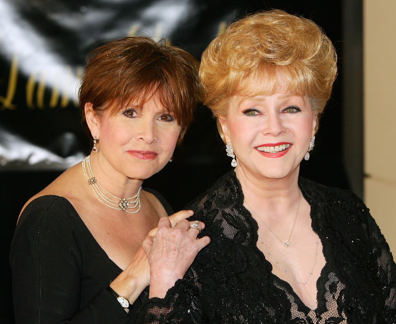 HENDERSON, NV - FEBRUARY 27: Actress Carrie Fisher (L) and her mother, actress Debbie Reynolds, arrive for Dame Elizabeth Taylor's 75th birthday party at the Ritz-Carlton, Lake Las Vegas on February 27, 2007 in Henderson, Nevada. (Photo by Ethan Miller/Getty Images)