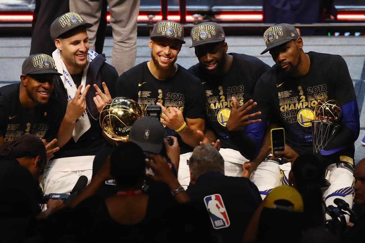CLEVELAND, OH - JUNE 08: Andre Iguodala #9, Klay Thompson #11, Stephen Curry #30, Draymond Green #23 and Kevin Durant #35 of the Golden State Warriors celebrate after defeating the Cleveland Cavaliers during Game Four of the 2018 NBA Finals at Quicken Loans Arena on June 8, 2018 in Cleveland, Ohio. The Warriors defeated the Cavaliers 108-85 to win the 2018 NBA Finals. NOTE TO USER: User expressly acknowledges and agrees that, by downloading and or using this photograph, User is consenting to the terms and conditions of the Getty Images License Agreement. (Photo by Justin K. Aller/Getty Images)