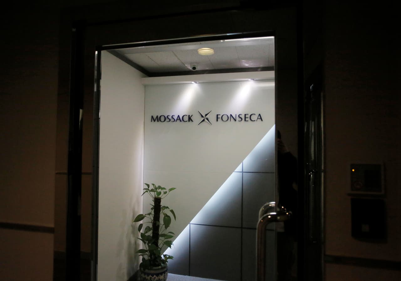 A potted plant is placed at the entrance of the regional head office of Panama-based law firm Mossack Fonseca, one of the world's biggest creators of shell companies, in Hong Kong, Tuesday, April 5, 2016. China's Internet censors and state media outlets squelched reports Tuesday on hidden wealth drawn from documents leaked from a Panama-based law firm that name relatives of current and retired Chinese politicians, including President Xi Jinping. (AP Photo/Vincent Yu)