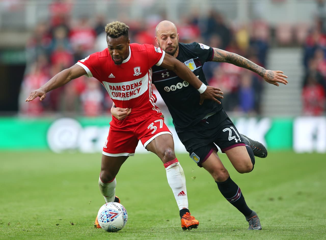 MIDDLESBROUGH, ENGLAND - MAY 12: Adama Traore of Middlesbrough is challenged by Alan Hutton of Aston Villa during the Sky Bet Championship Play Off Semi Final First Leg match between Middlesbrough and Aston Villa at Riverside Stadium on May 12, 2018 in Middlesbrough, England. (Photo by Alex Livesey/Getty Images)