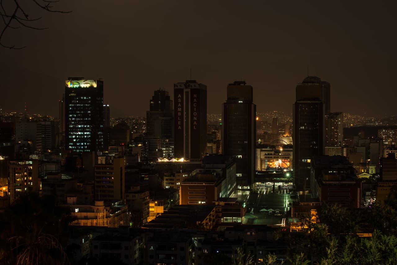 Several government buildings are seen with their lights off in Caracas on Tuesday, March 22, 2016.