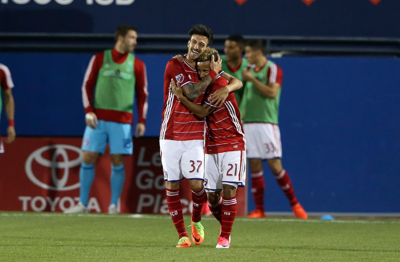 Apr 8, 2017; Dallas, TX, USA; FC Dallas midfielder Michael Barrios (21) celebrates with forward Maximiliano Urruti (37) after scoring a goal during the second half against the Minnesota United at Toyota Stadium. Mandatory Credit: Kevin Jairaj-USA TODAY Sports