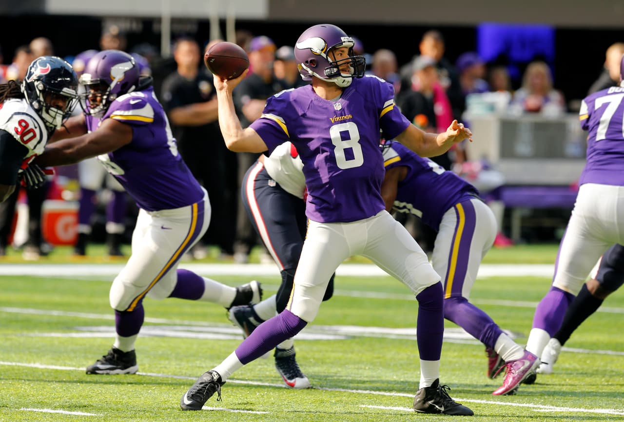 Minnesota Vikings quarterback Sam Bradford throws a pass during the first half of an NFL football game against the Houston Texans Sunday, Oct. 9, 2016, in Minneapolis. (AP Photo/Jim Mone)