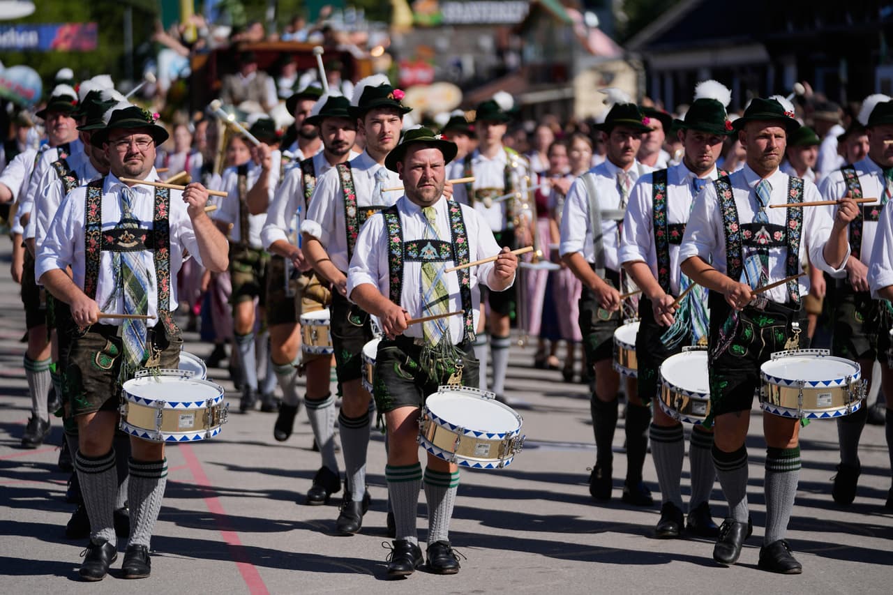 Musicians wear traditional costumes in the Oktoberfest parade at the 191st Oktoberfest beer festival in Munich, Germany, Saturday, Sept.19, 2026. (AP Photo/Matthias Schrader)