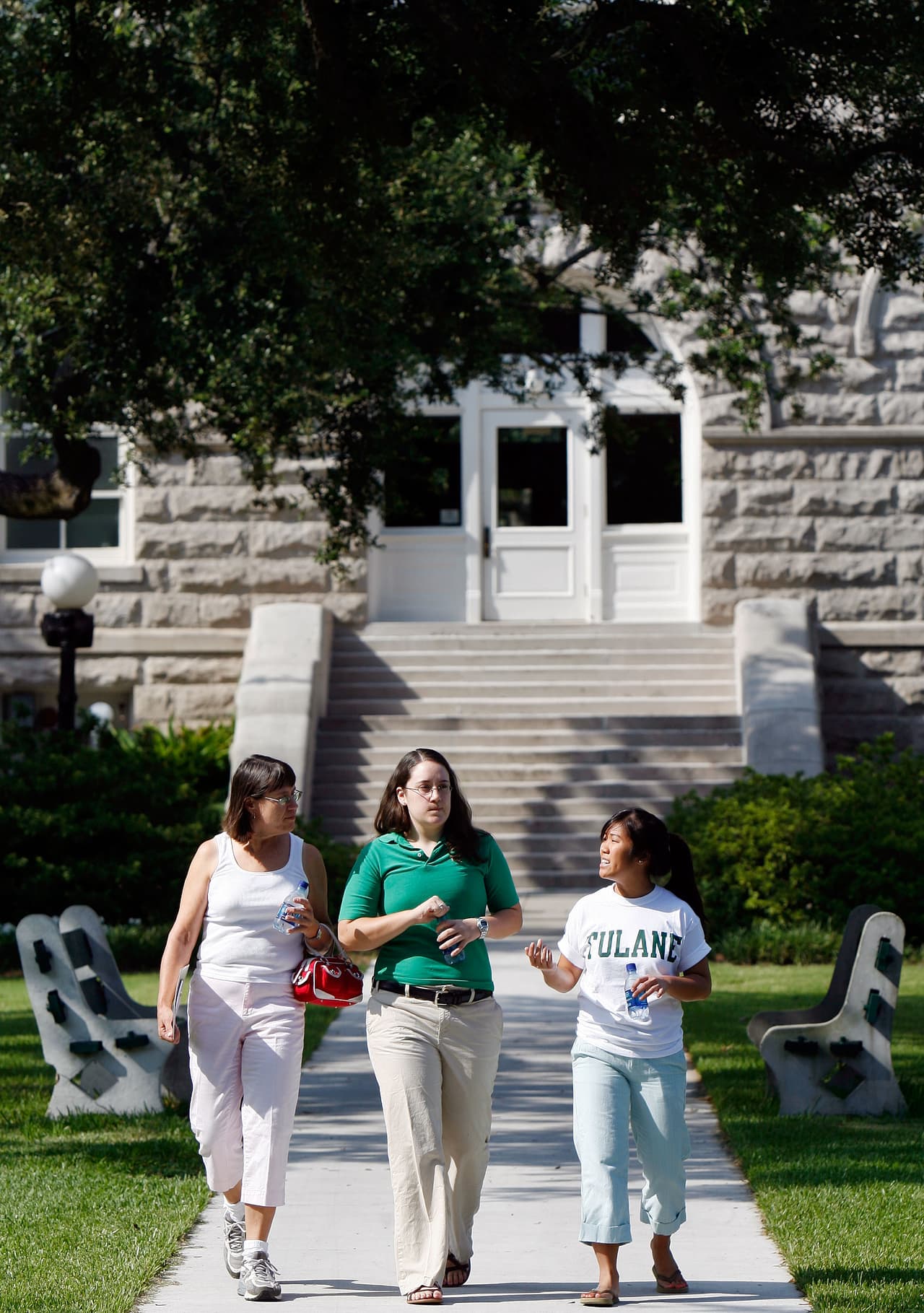 Joann Brothers left, and her daughter Elizabeth Brothers, from Midlothian, Va. tours Tulane University with Stephanie Choy, a student worker in the admissions department in New Orleans on Wednesday, Aug. 16, 2006. (AP Photo/Alex Brandon)