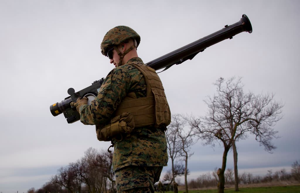 A US Marine carries a Stinger air defense missile launcher during training at the Capu Midia Surface to Air Firing Range, on the Black Sea coast in Romania, Monday, March 20, 2017.