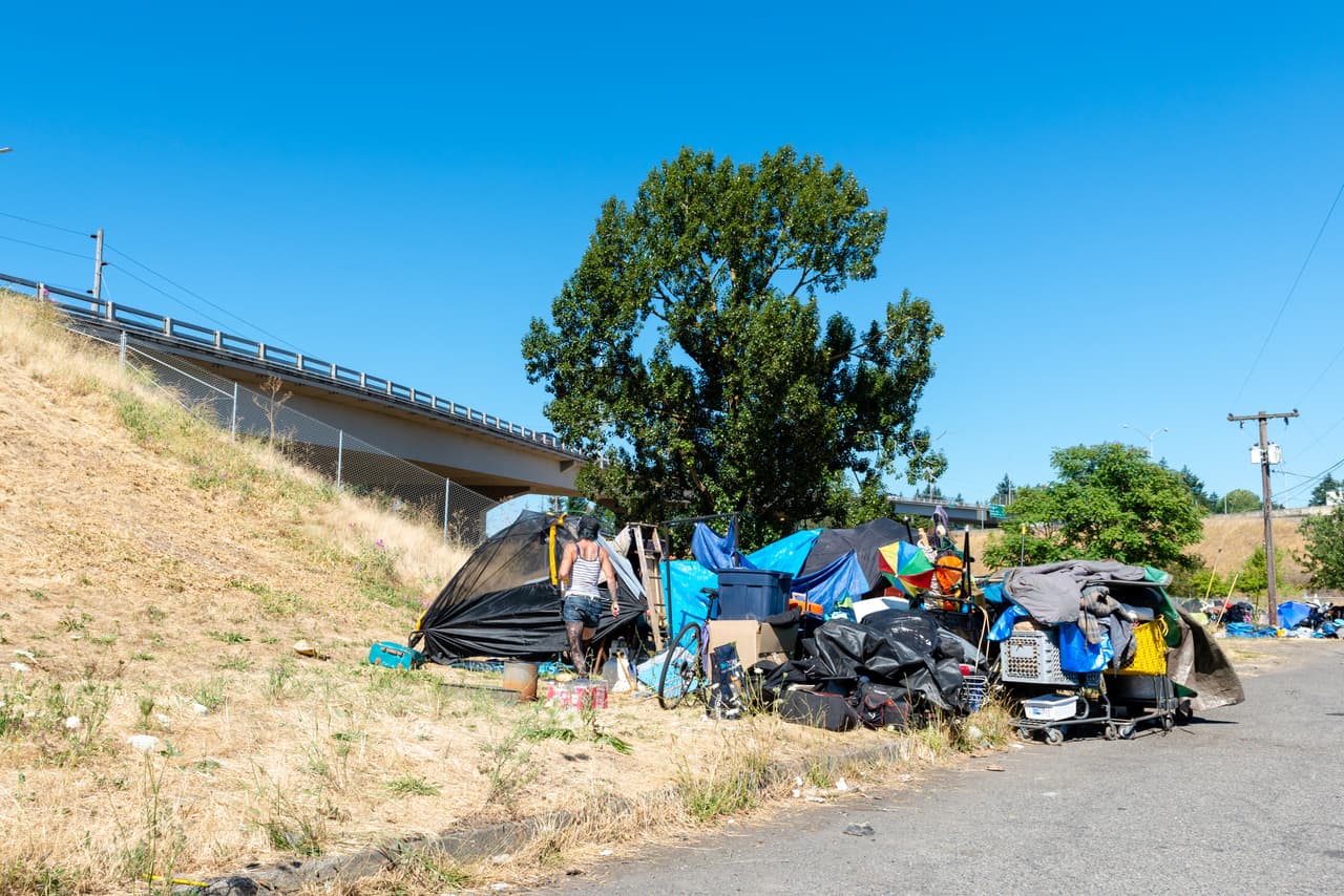 Clusters of tents line the streets of downtown Portland, Ore. (Heidi de Marco/KHN)
