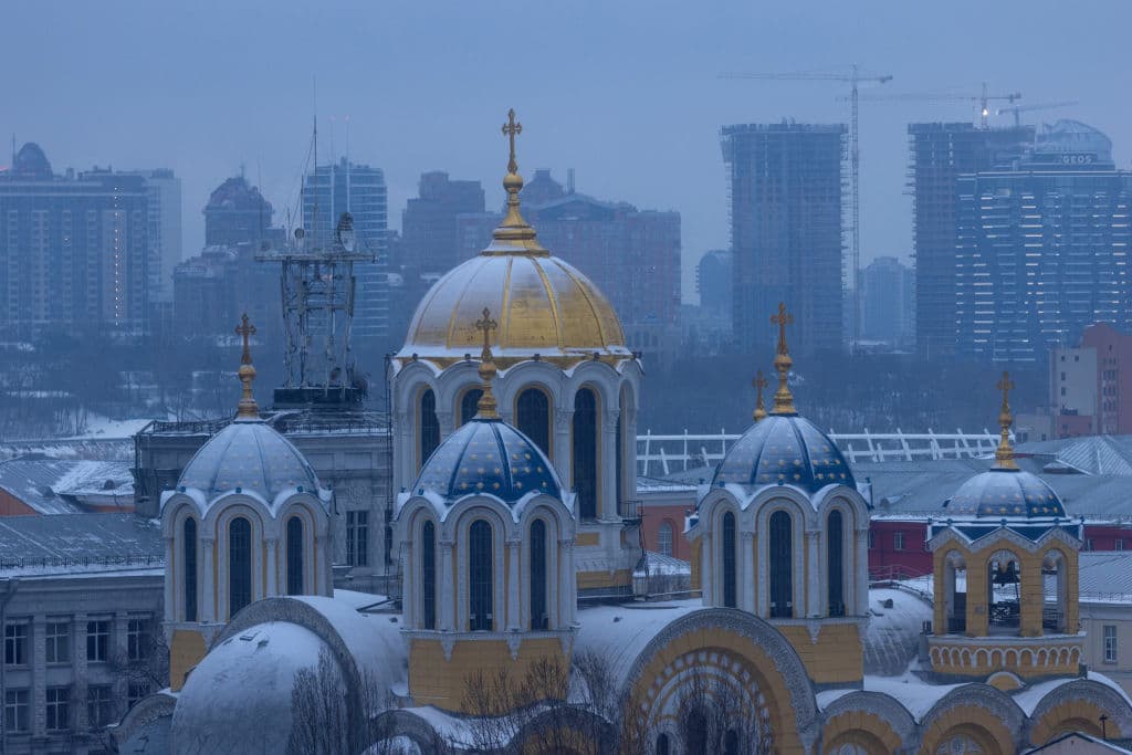 The dome's of St Volodymyr's Cathedral are seen against the city skyline on January 28, 2022 in Kyiv, Ukraine.