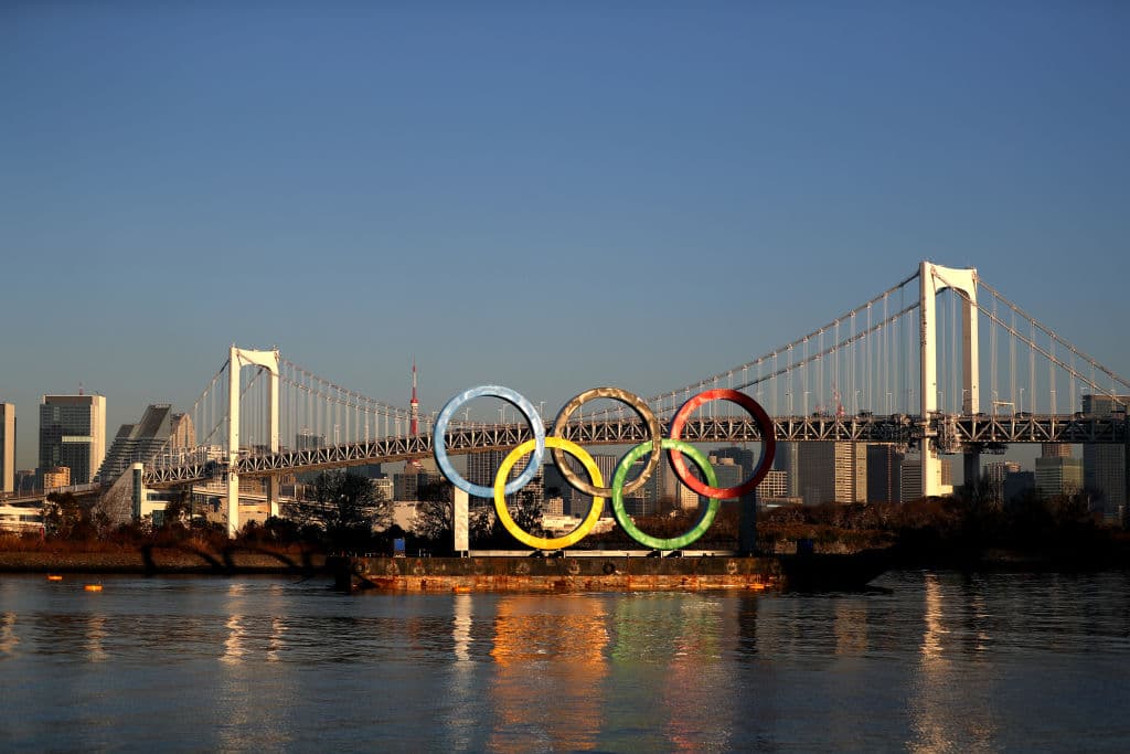 TOKYO, JAPAN - JANUARY 20: The Olympic rings are seen at sunrise in front of Tokyo's iconic Rainbow Bridge and Tokyo Tower at Odaiba Marine Park on January 20, 2020 in Tokyo, Japan. (Photo by Clive Rose/Getty Images)