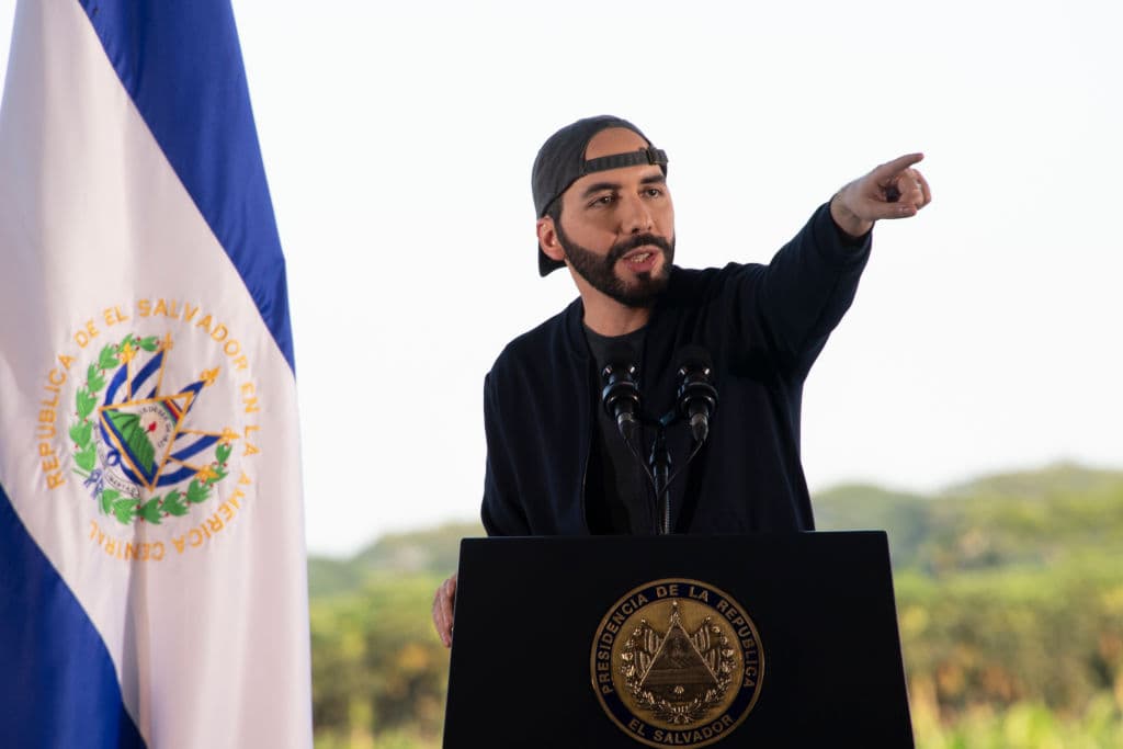 El Salvador's President Nayib Bukele, accompanied by members of the armed forces, speaks to supporters outside Congress in San Salvador, El Salvador, Feb 9, 2021.