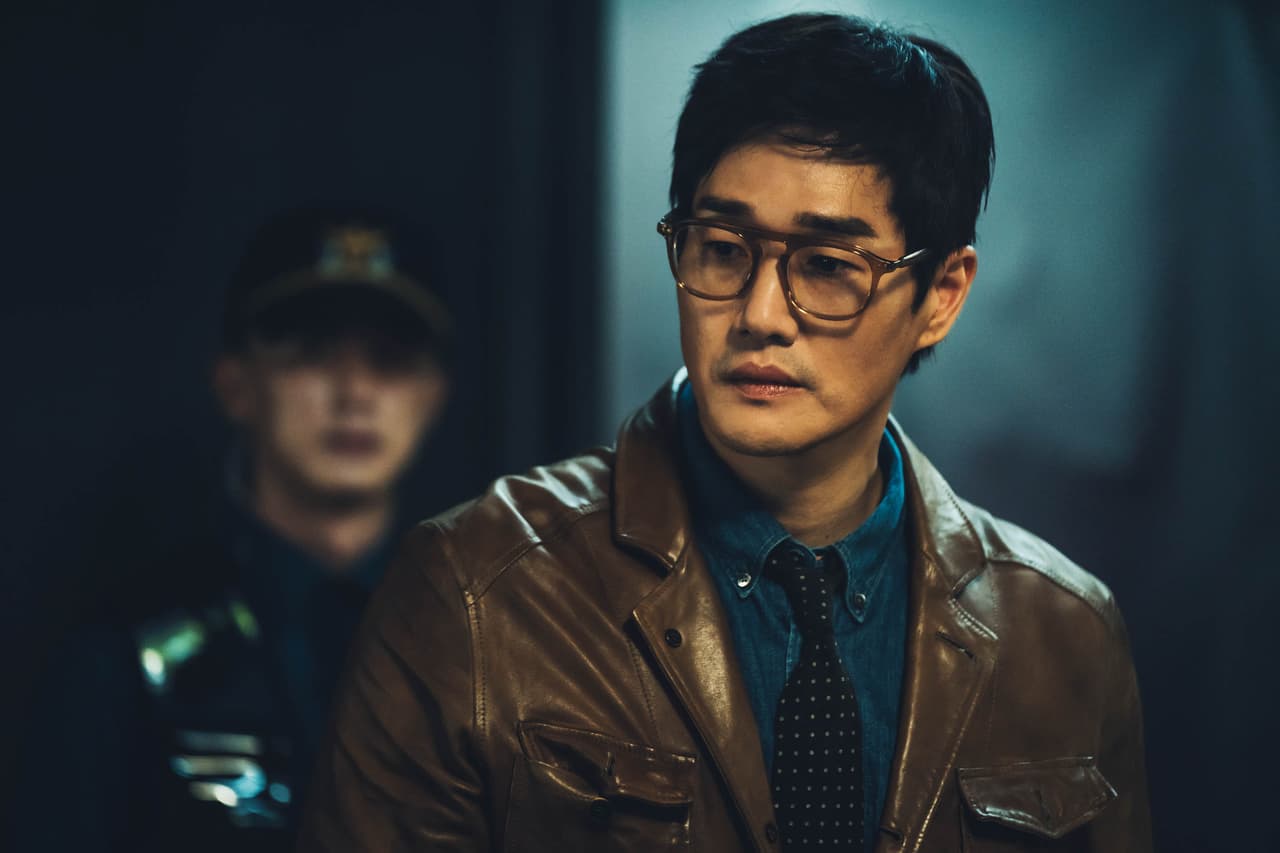 Money Heist Korea: JEA Yoo Ji-tae as Professor in episode # 1 of Money Heist Korea: JEA. Cr. Jung Jaegu/Netflix © 2021