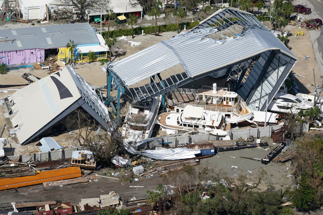 Damaged boats and structures are seen in the aftermath of Hurricane Ian, Thursday, Sept. 29, 2022, in Fort Myers Beach, Fla.