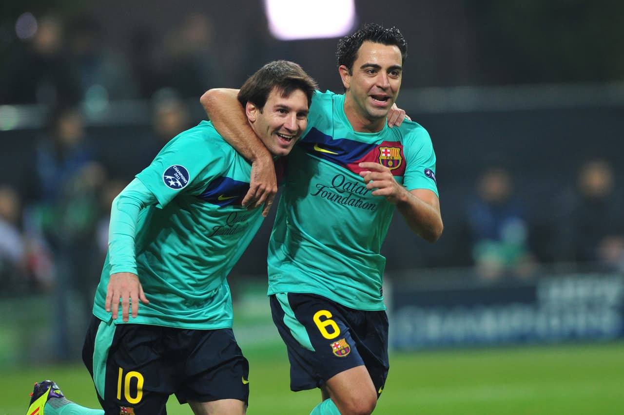 Lionel Messi y Xavi Hernández.