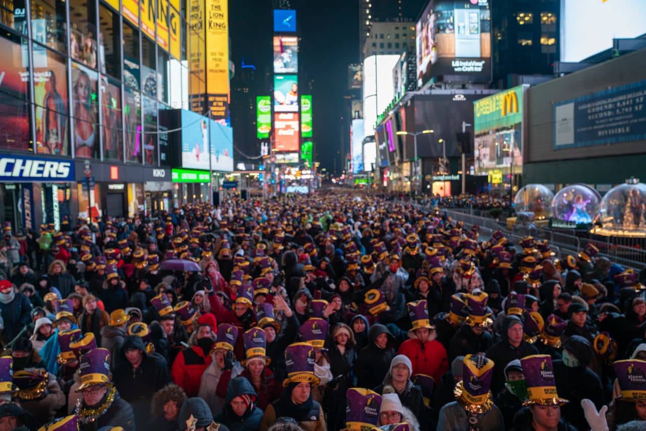 NEW YORK, NY - DECEMBER 31: Revelers at Times Square during the New Year's Eve celebration on December 31, 2019 in New York City. People began celebrating New Year's Eve at Times Square in 1904, in 1907 the New Year's Eve Ball made its first descent from the flagpole at One Times Square. (Photo by David Dee Delgado/Getty Images)