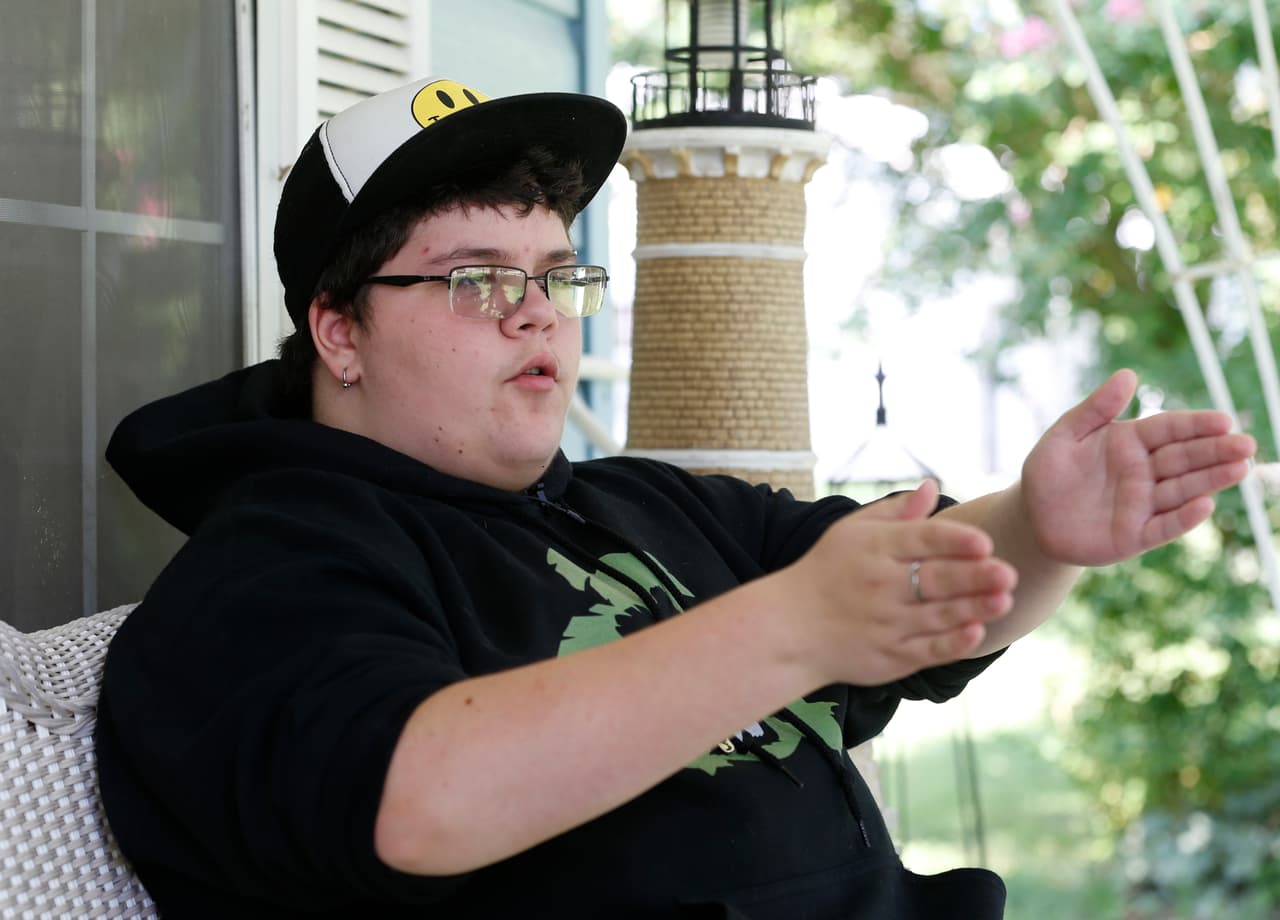 This Tuesday Aug. 25, 2015 photo shows Gavin Grimm as he gestures during an interview at his home in Gloucester, Va. Grimm is a transgender student whose demand to use the boys' restrooms has divided the community and prompted a lawsuit. (AP Photo/Steve Helber)