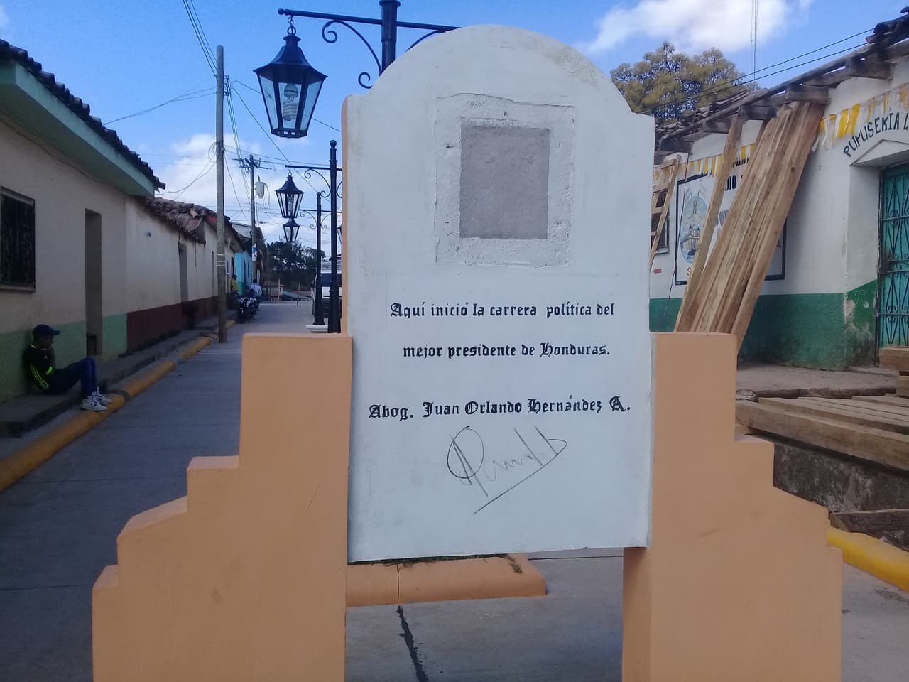 A cement plaque sits along a road that’s under construction in Valladolid, Lempira, the home province of President Juan Orlando Hernández: “Here began the political career of Honduras’ best president,” signed by Hernández himself.