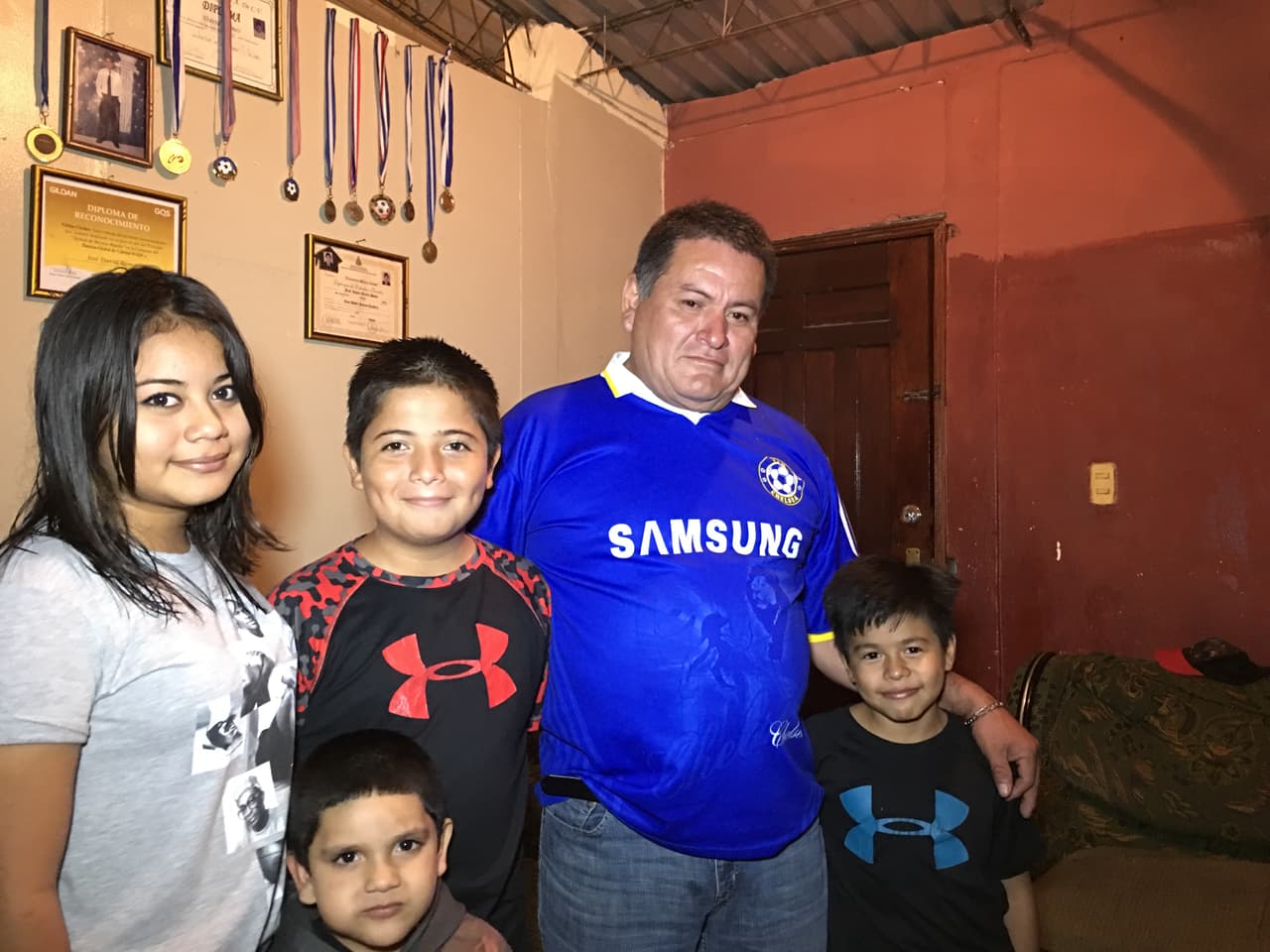 Jose Ramos, 22, was shot dead in an anti-government protest Dec 1 2017 in Choloma, Honduras. His family is seeking justice. Left to right: his sister maria, 13, brother Jose Daniel, 12, father David Ramos, and his son Juan Angel, 8.