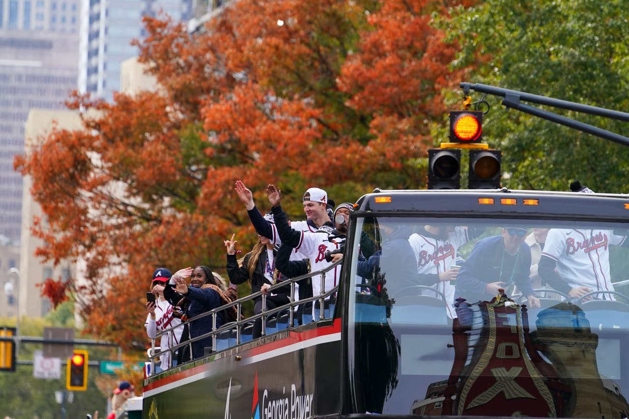 Atlanta Braves players celebrate the team's victory during a victory parade, Friday, Nov. 5, 2021, in Atlanta. The Braves beat the Houston Astros 7-0 in Game 6 on Tuesday to win their first World Series baseball title in 26 years. (AP Photo/Brynn Anderson)