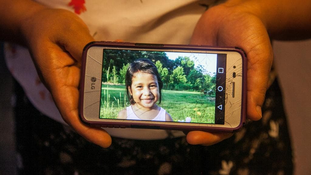 For months, the family of Yanci has had to settle for seeing her in photos like this one that shows on her phone a relative of the girl living in South Florida.