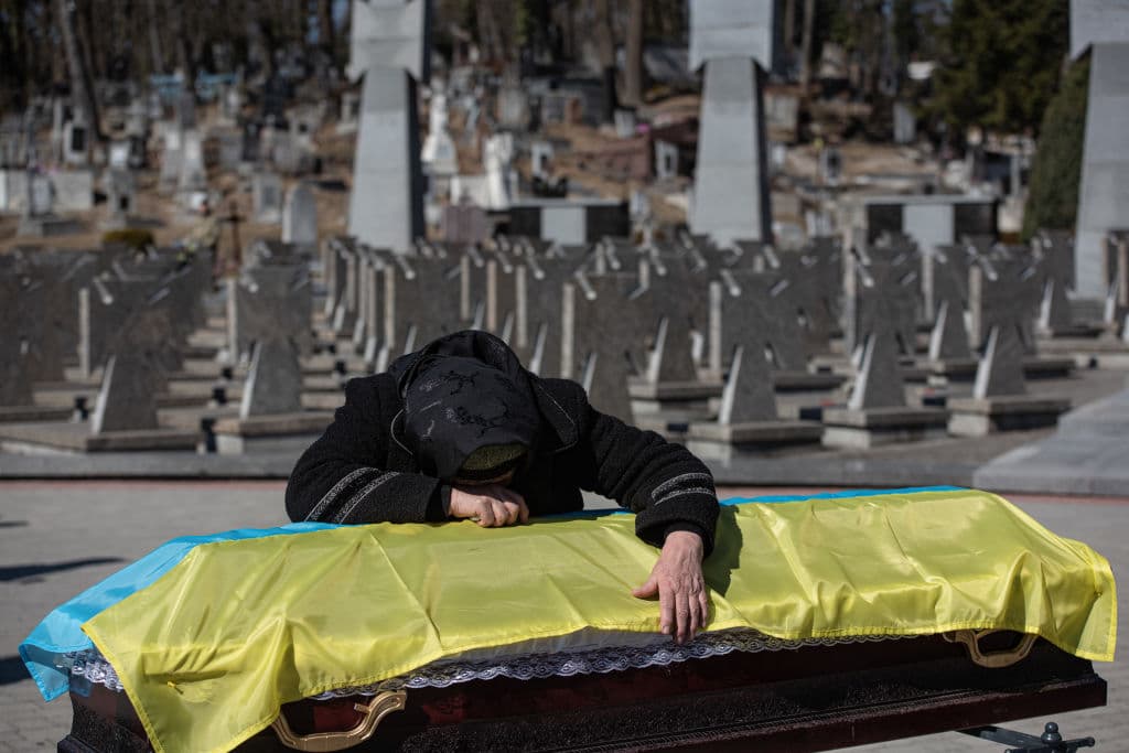 The mother of Ukrainian officer Ivan Skrypnyk cries over the coffin with the body of her son, during the funeral ceremony on March 17, 2022 in Lviv, Ukraine. The soldier died in Sunday's airstrike on the nearby International Center for Peacekeeping and Security at the Yavoriv military complex. The barrage of Russian missiles killed 35 and wounded scores.