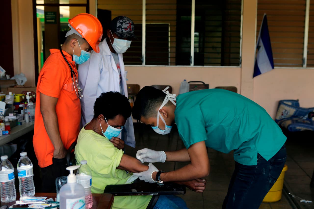 A student recieves medical atention at Nicaragua's Polytechnic University, during protests against Nicaraguan President Daniel Ortega's government in Managua on April 25, 2018. - A week of brutally repressed anti-government protests in Nicaragua has killed at least 34 people, a leading rights group in the country said Wednesday. The protests were triggered by pension reforms that President Daniel Ortega ended up withdrawing amid mounting condemnation of the harsh police tactics against the demonstrators. (Photo by INTI OCON / AFP) (Photo credit should read INTI OCON/AFP/Getty Images)