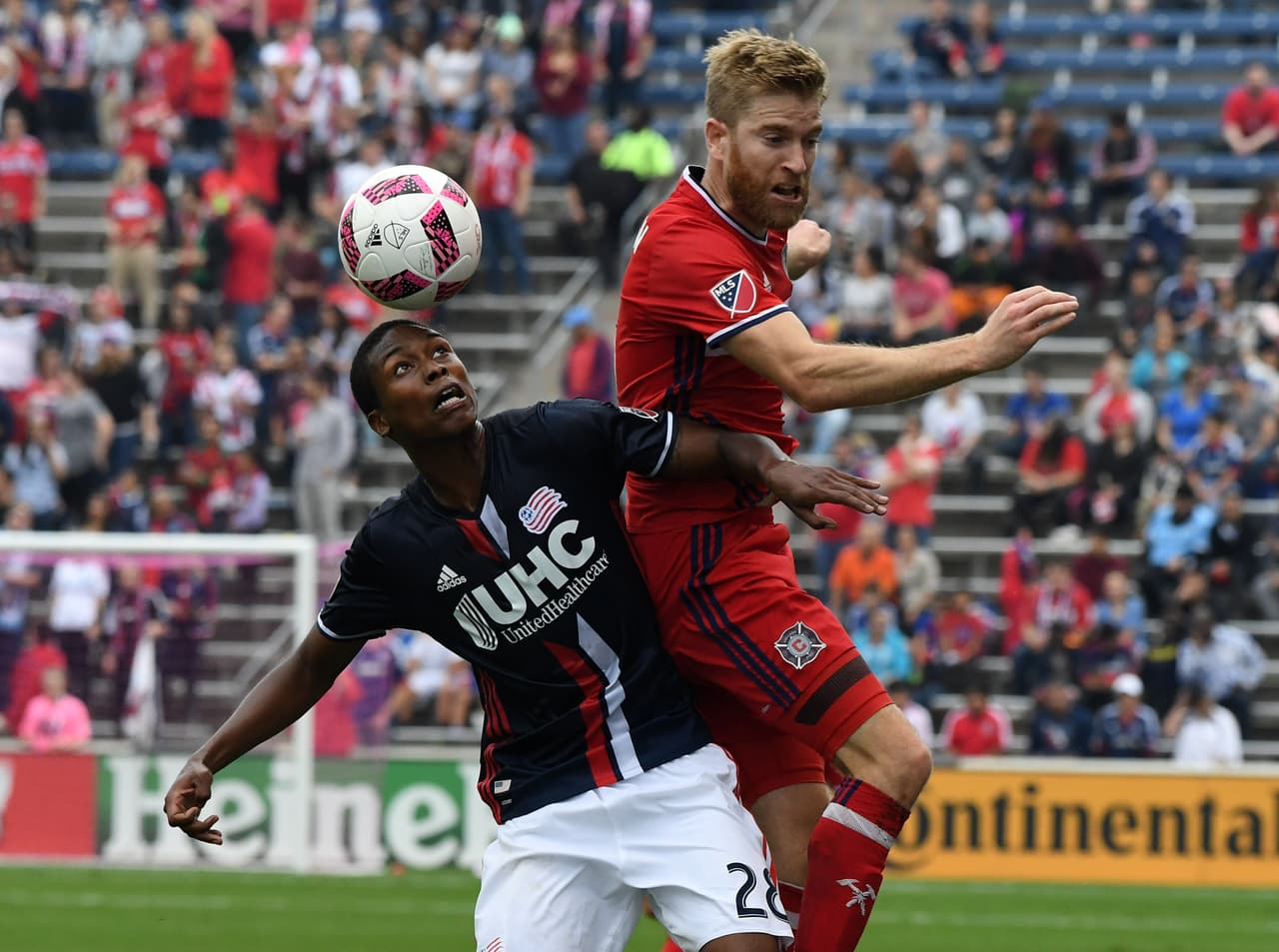 Oct 16, 2016; Chicago, IL, USA; Chicago Fire midfielder Michael de Leeuw (8) and New England Revolution defender London Woodberry (28) head the ball during the first half at Toyota Park. Mandatory Credit: Mike DiNovo-USA TODAY Sports