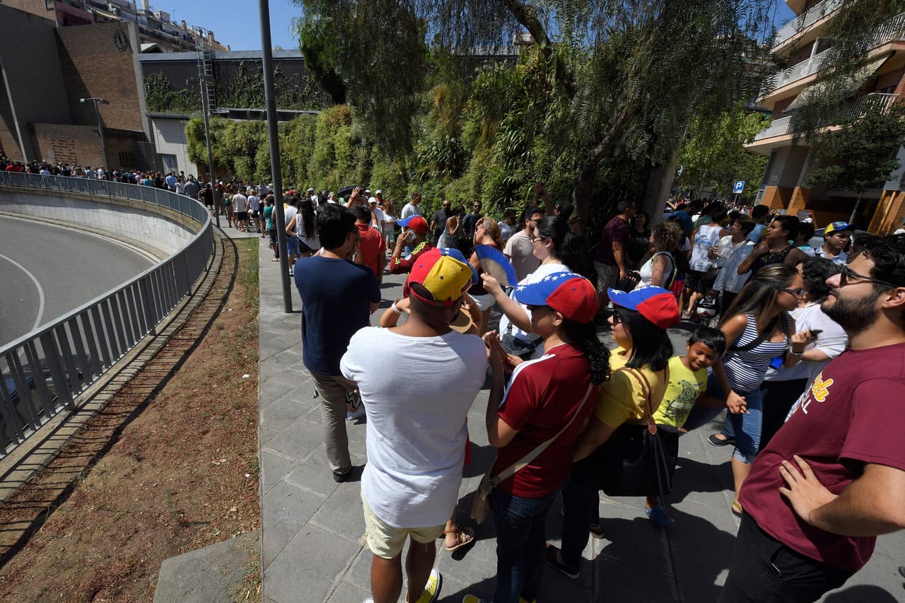 Venezuelans in Barcelona, Spain, line up to vote in the symbolic election against Nicolas Maduro.