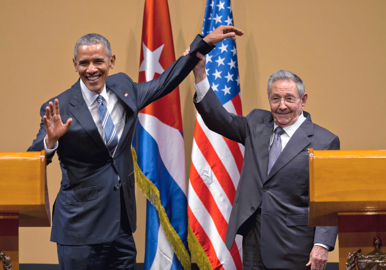 FILE - In this March 21, 2016 file photo, Cuban President Raul Castro, right, lifts up the arm of U.S. President Barack Obama, at the conclusion of their joint news conference at the Palace of the Revolution, in Havana, Cuba. The United States will vote this week against an annual United Nations resolution condemning the U.S. embargo on Cuba, reversing the Obama administration’s abstention last year. (AP Photo/Ramon Espinosa, File)