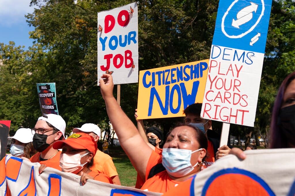 People rally for immigration reform and a path to citizenship, Thursday, Oct. 7, 2021, in Lafayette Park near the White House in Washington.