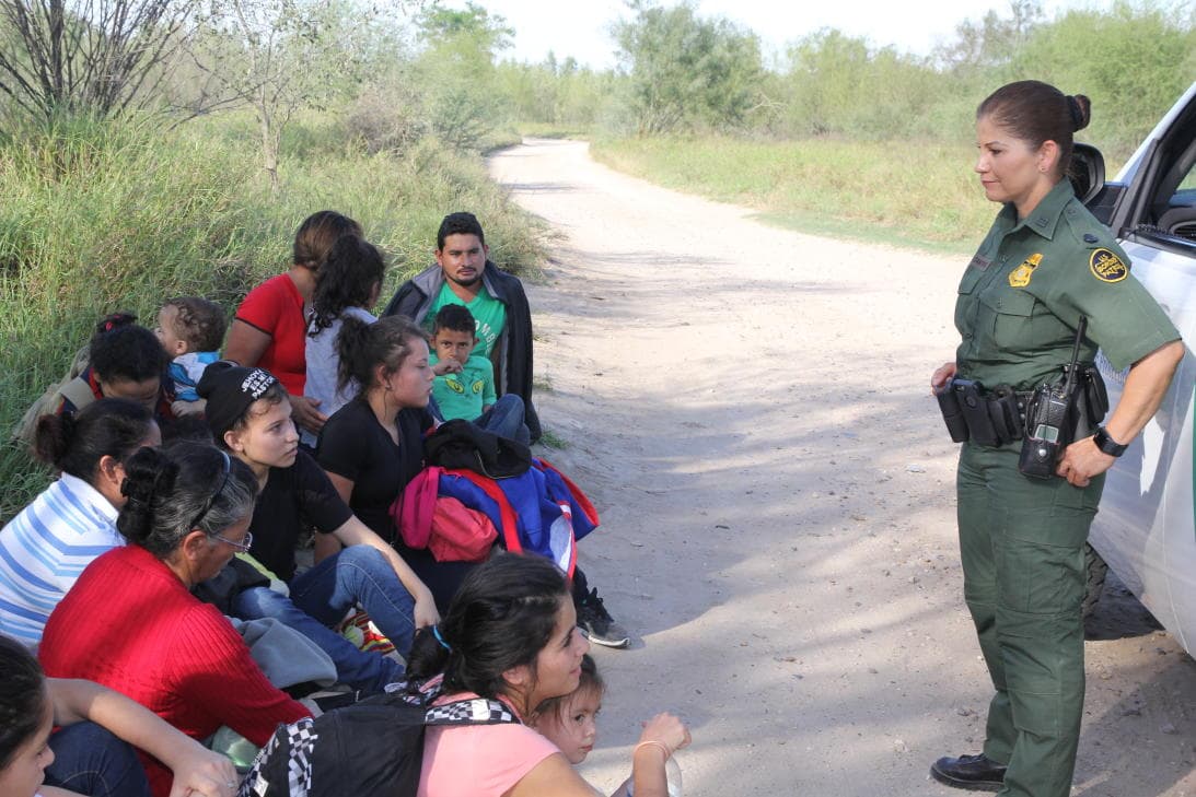 Agent Marlene Castro finds a group of 15. Meanwhile, the radio transmitter reports 21 more migrants found in the same area. Parents are asked by the Border Patrol agent for documents.