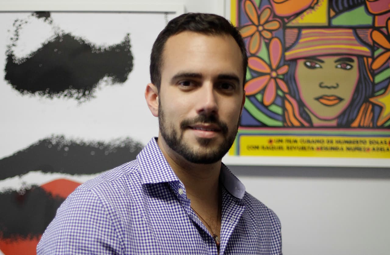 Felice Gorordo poses in his office in Miami Beach, Florida, December 19, 2014. The Obama Administration's new policy on Cuba is banking on a groundswell of support from new voices in Miami, the young Cuban professionals who do not espouse their parents isolationist sentiments on Cuba and want to engage. In recent months the White House had feelers out to several groups in the community who were sworn to silence, especially one young group called Roots of Hope. Photo taken December 19, 2014. REUTERS/Javier Galeano (UNITED STATES - Tags: POLITICS) - RTR4IUQO