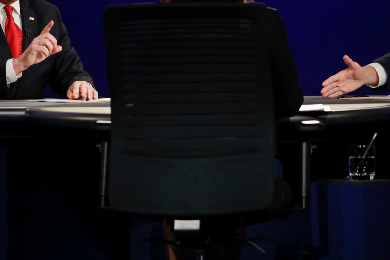 Republican vice-presidential nominee Gov. Mike Pence, right and Democratic vice-presidential nominee Sen. Tim Kaine gesture as they exchange views on a question during the vice-presidential debate at Longwood University in Farmville, Va., Tuesday, Oct. 4, 2016. (AP Photo/David Goldman)