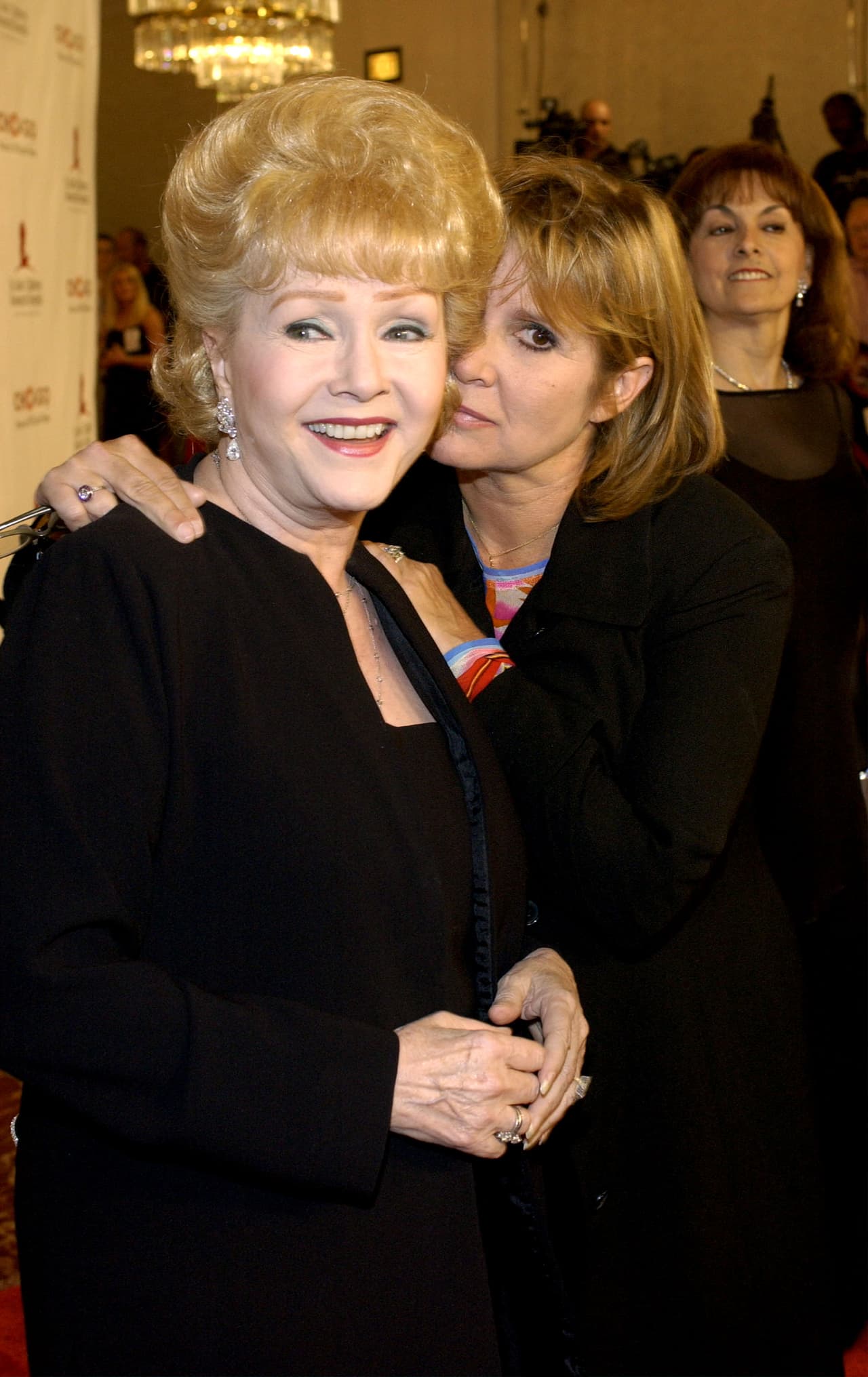 BEVERLY HILLS, CA - AUGUST 19: Actress Carrie Fisher and actress Carrie Reynolds attend the 2nd Annual "Runway for Life" celebrity fashion show benefiting St. Jude Children's Research Hospital and celebrating the DVD release of the Academy Award winning film "Chicago" at the Beverly Hilton August 19, 2003 in Beverly Hills, California. (Photo by Vince Bucci/Getty Images)